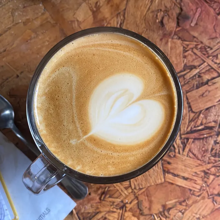 Heart latte art in a glass mug at Sheppard’s Cafe