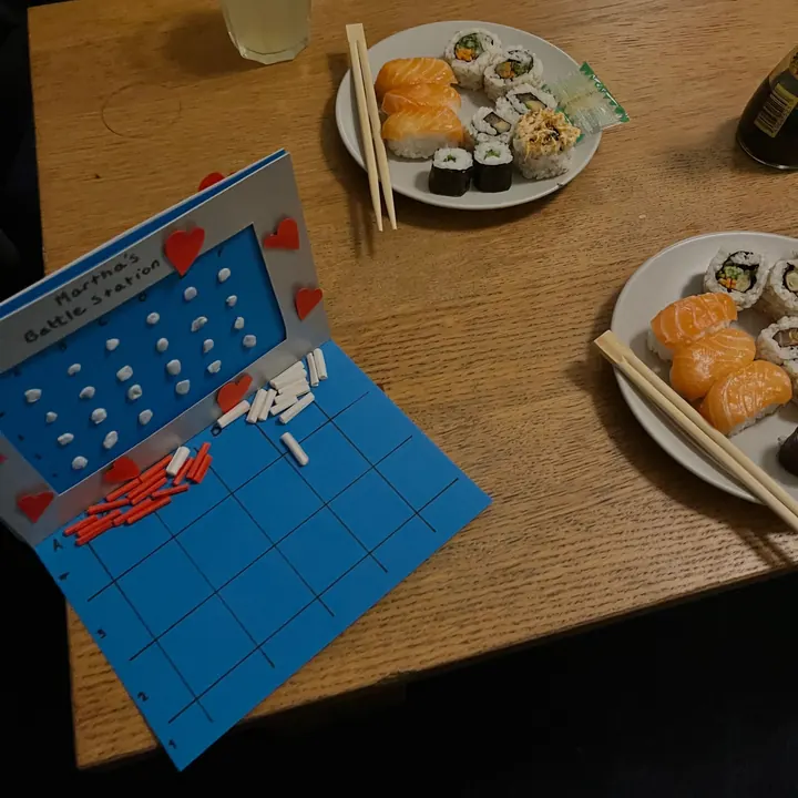 Homemade sushi beside a handmade Battleship Valentine’s card