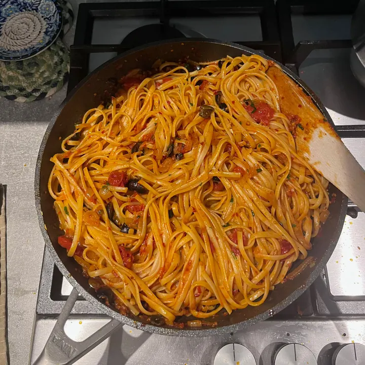 Pan of Ottolenghi’s harissa spaghetti on the hob